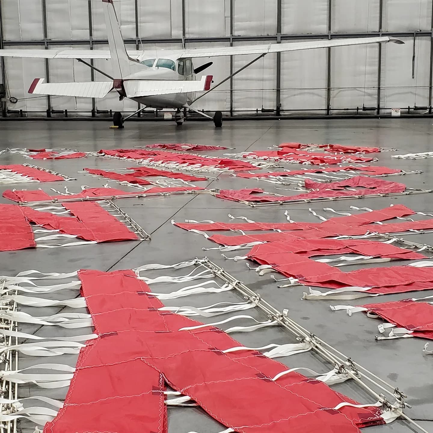 Letter banner segments laid out in the hangar ready for flight
